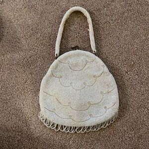 White beaded evening bag with fringe
